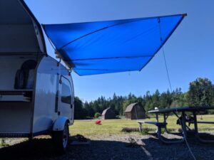 The awning by Shady Boy is an optional add-on for the DROPLET small trailer