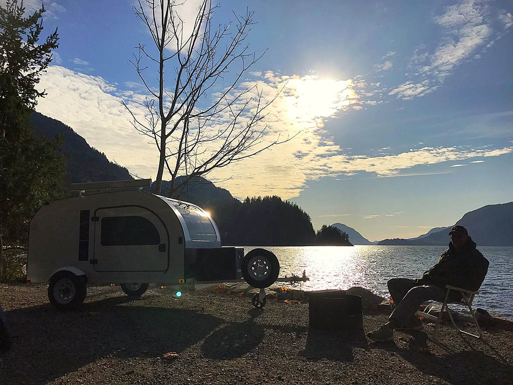 Man camping at Porteau Cove, BC with a DROPLET Trailer