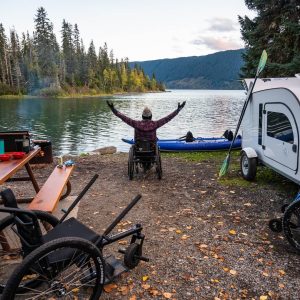 Wheelchair Accessibility A woman with limited mobility is enjoying nature by her DROPLET trailer.